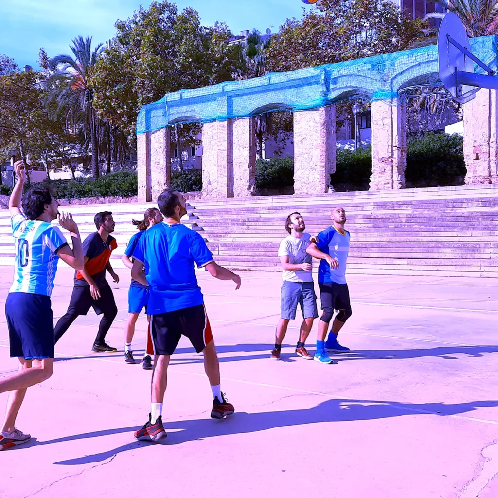 teams playing basketball in an outdoor court