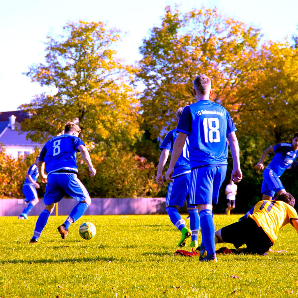 boys in a middle of a football game