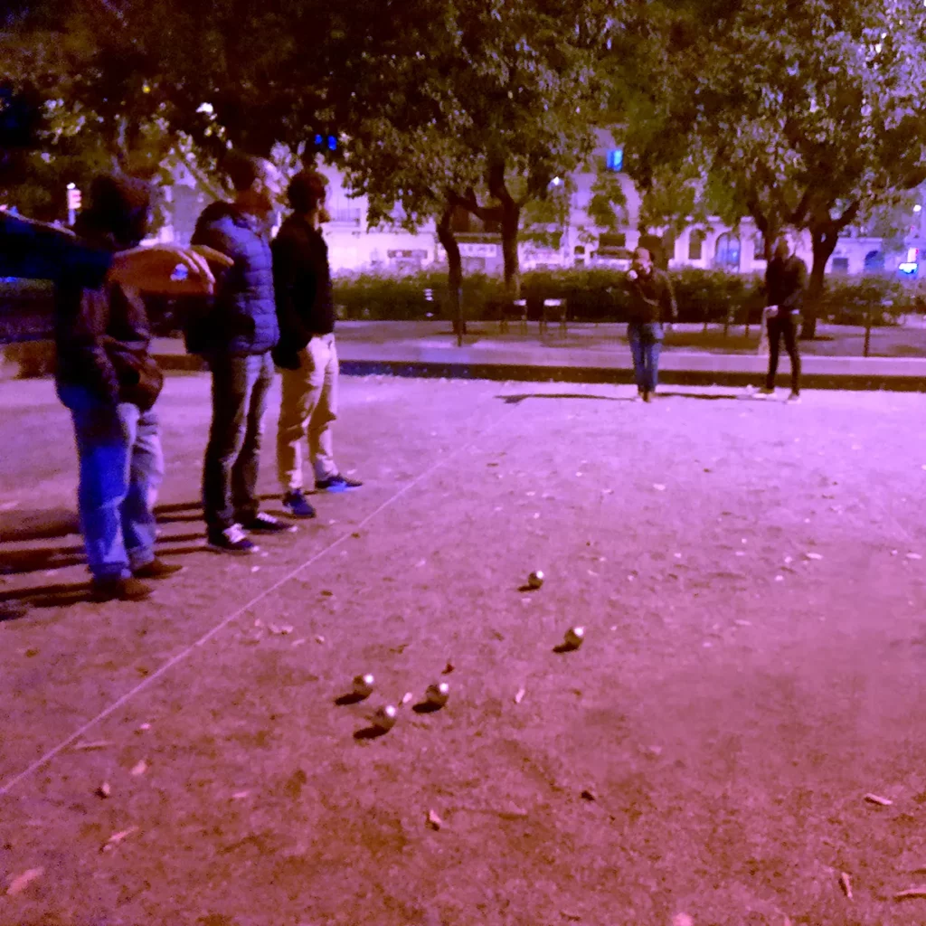 two teams during winter petanque game in a outdoor petanque ground