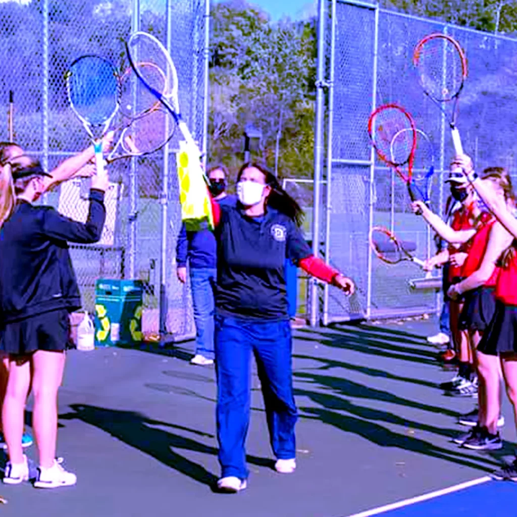 Tennis women team spirit before starting the activity